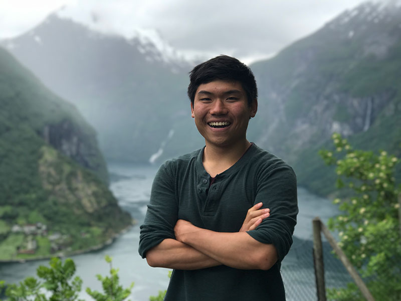 Dr Jaffly Chen with mountainous landscape